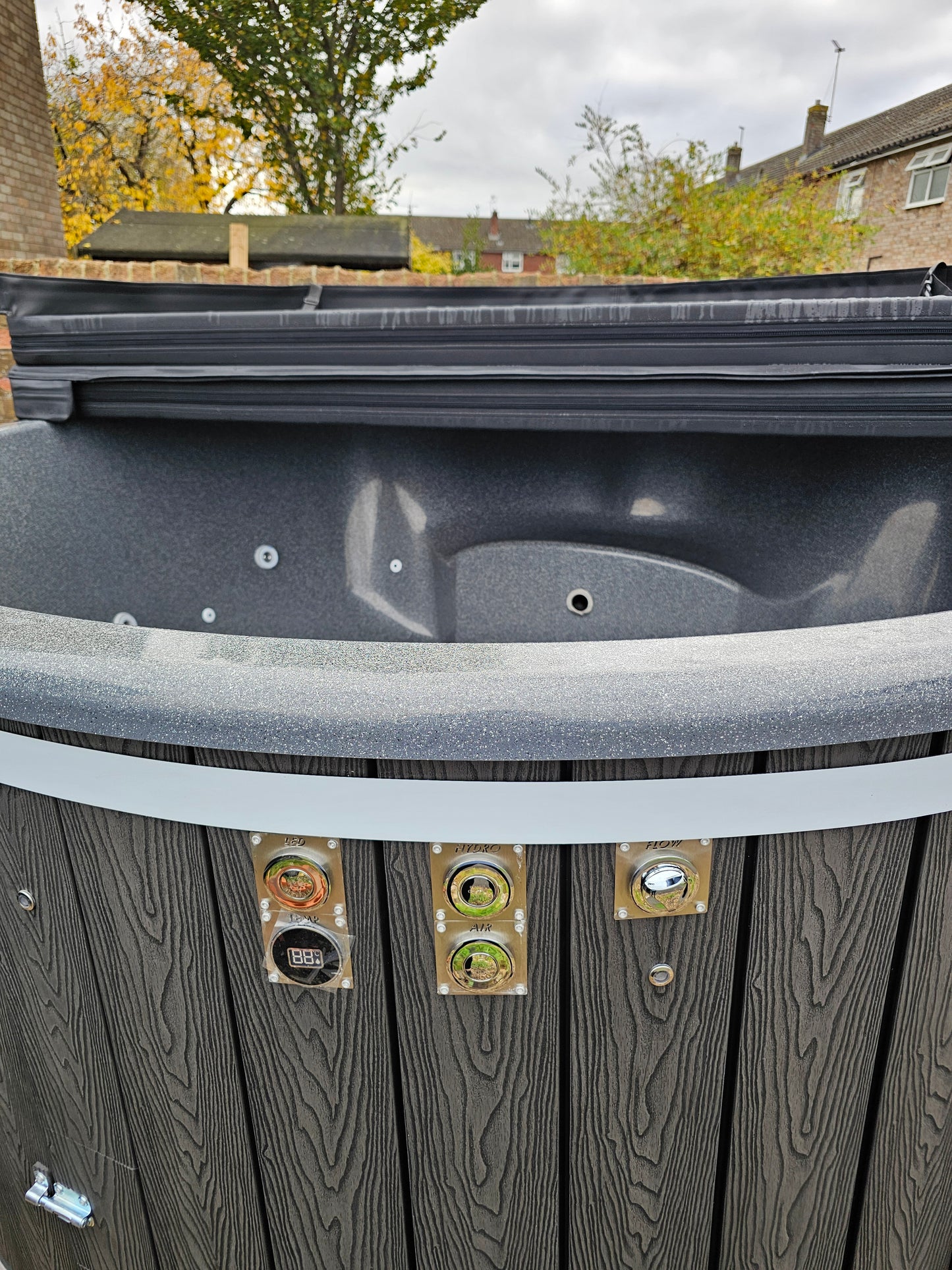 Round Wood-Fired Hot Tub with Integrated Log Burner