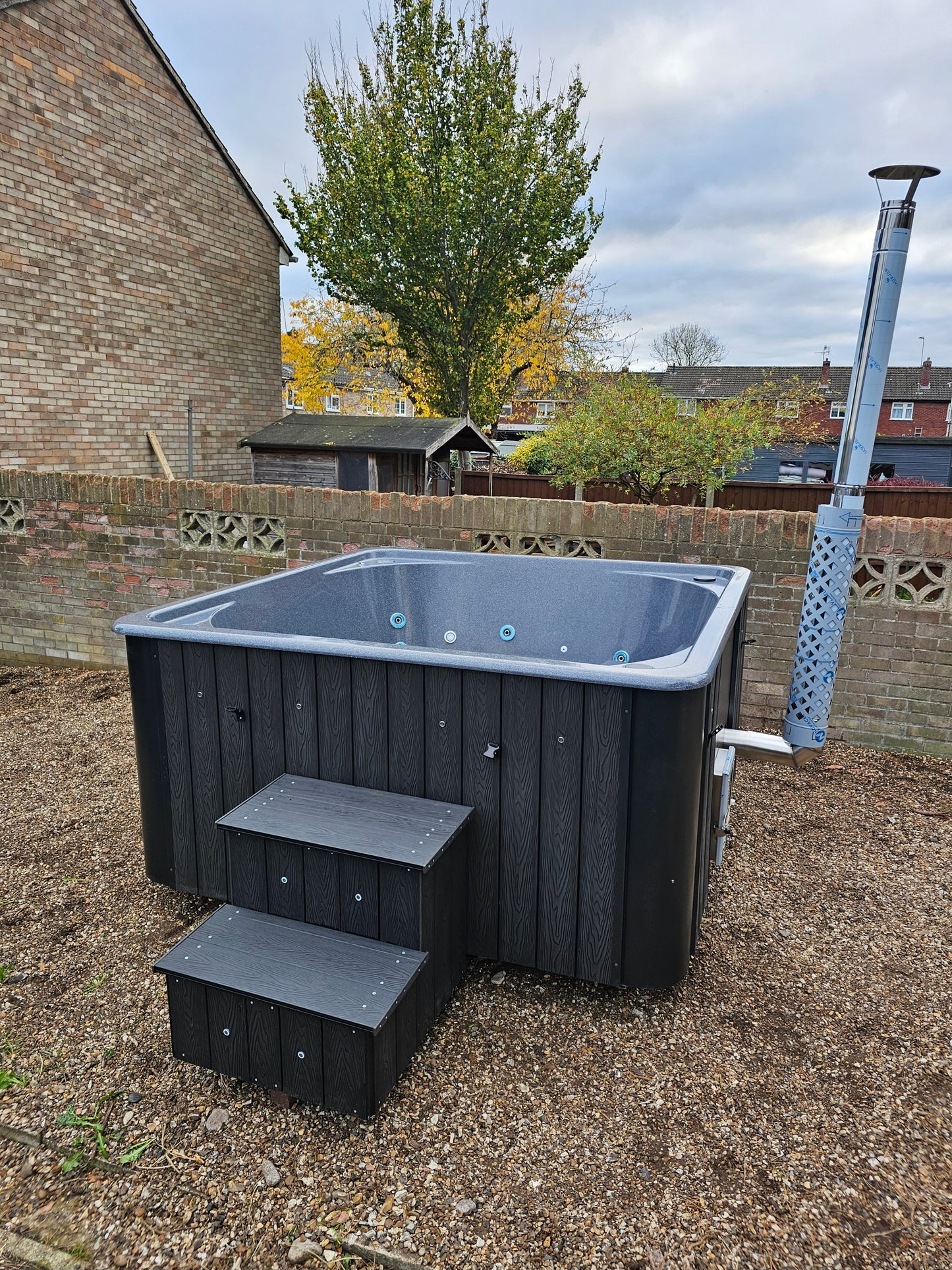 Rectangular Wood-Fired Hot Tub with Integrated Log Burner