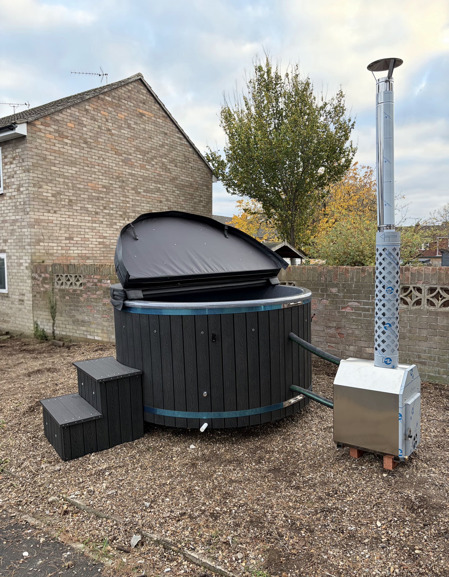 Round Wood-Fired Hot Tub with External Log Burner