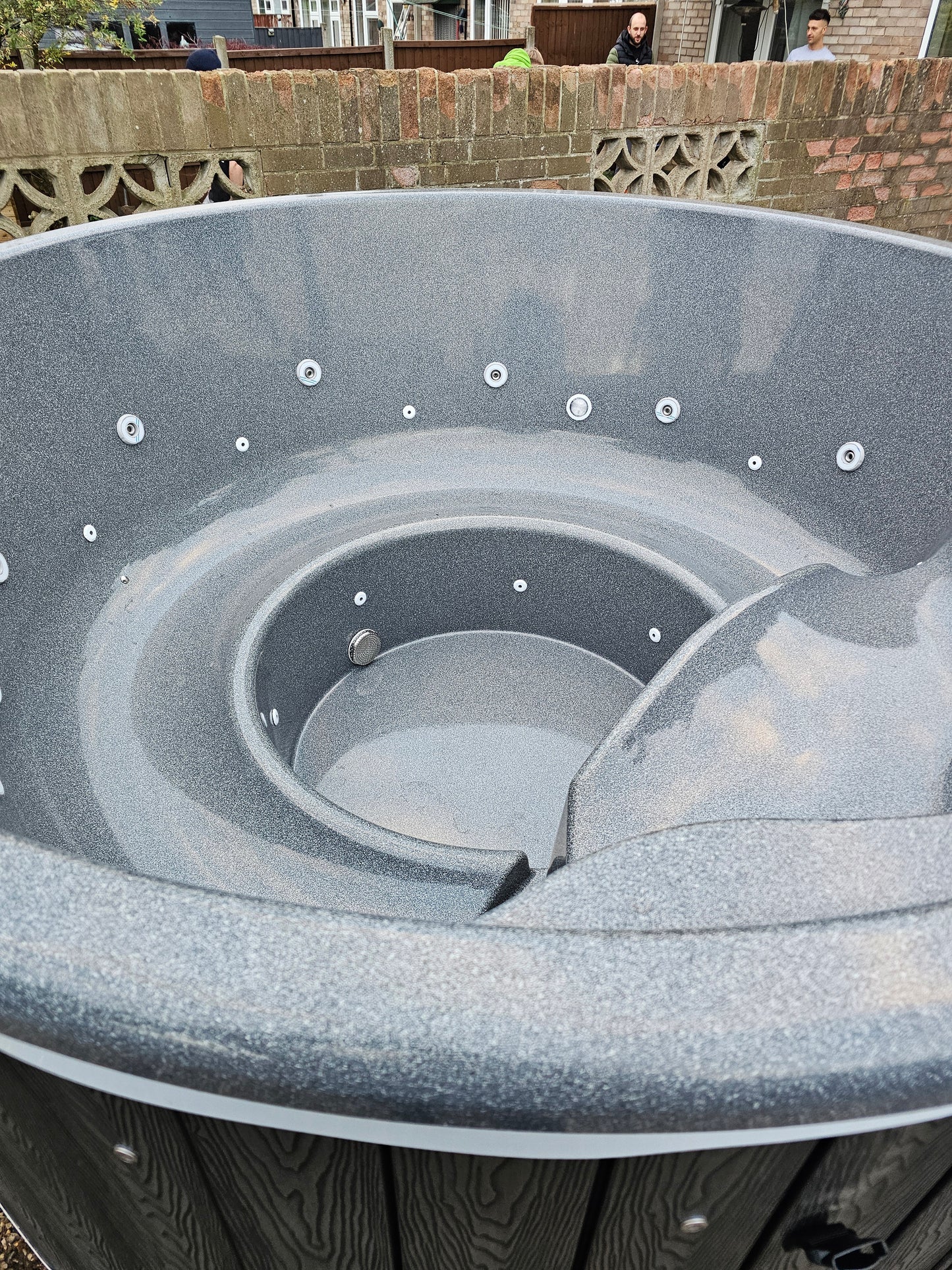 Round Wood-Fired Hot Tub with Integrated Log Burner