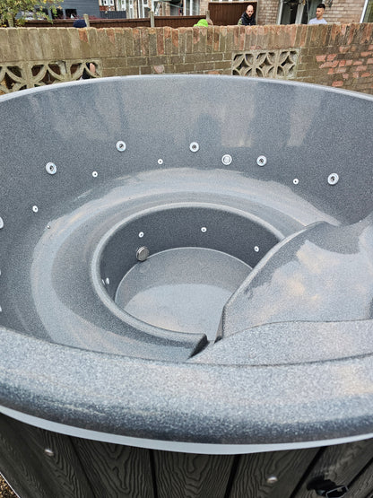 Round Wood-Fired Hot Tub with Integrated Log Burner