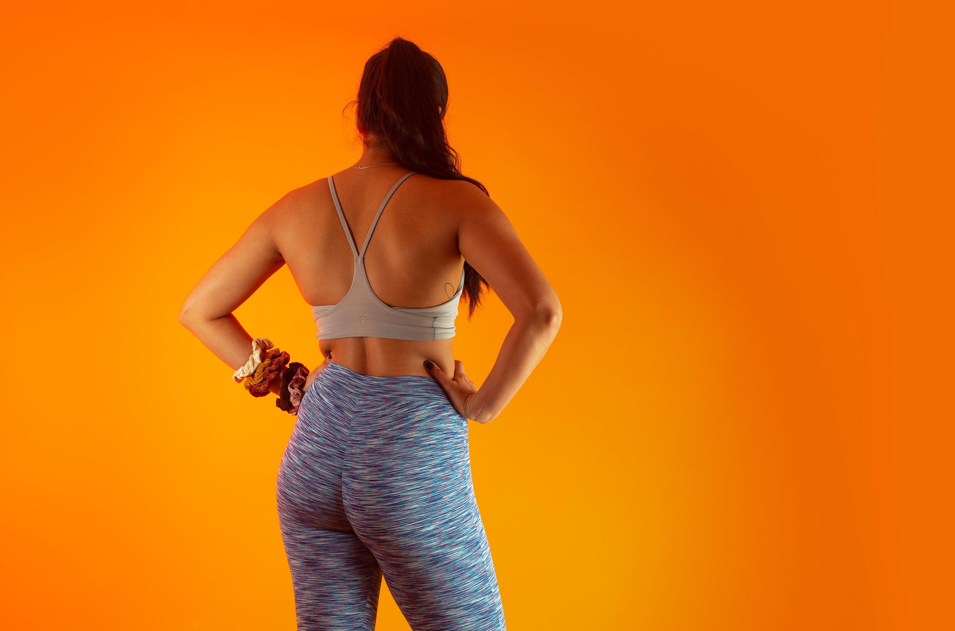 Woman stretching after exercise showing sauna and hot tub muscle recovery benefits